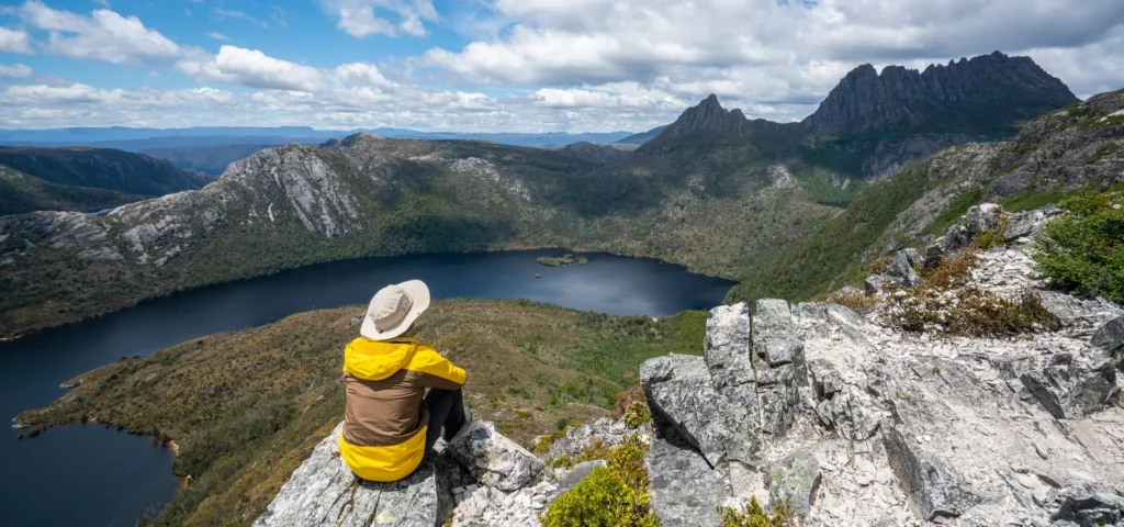 Man sitting on rock at Looking Glass Bay, Tasmania